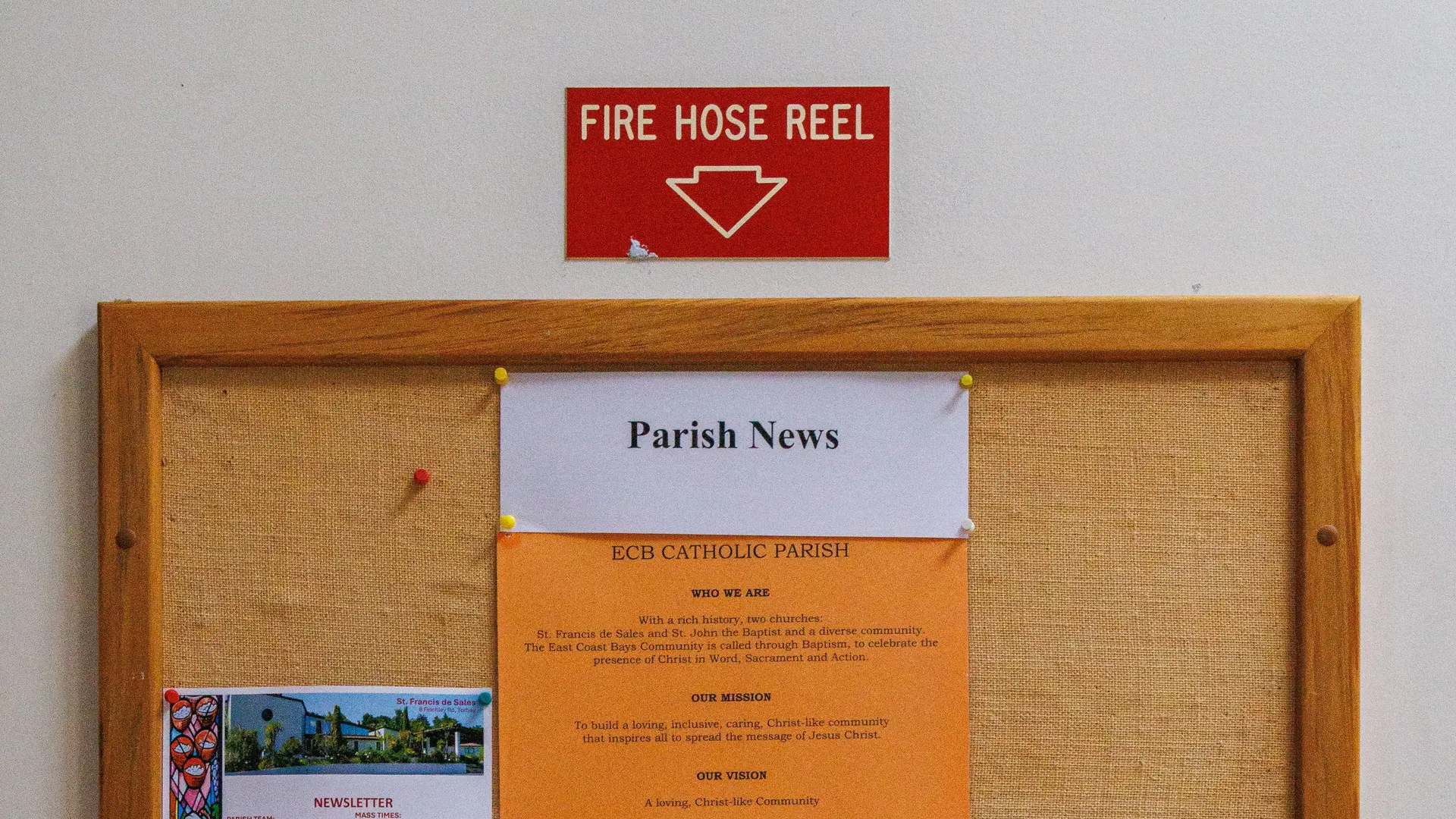 A notice board in a building entrance.